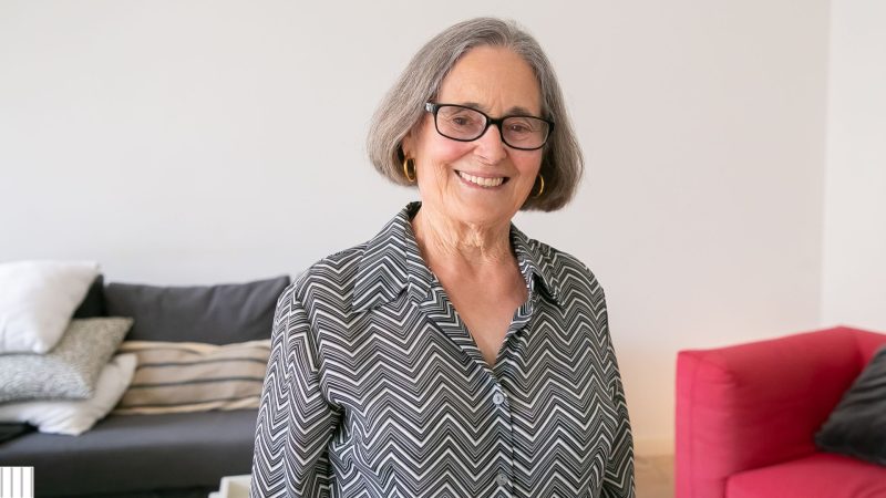 older female who restored her smile with dental implants